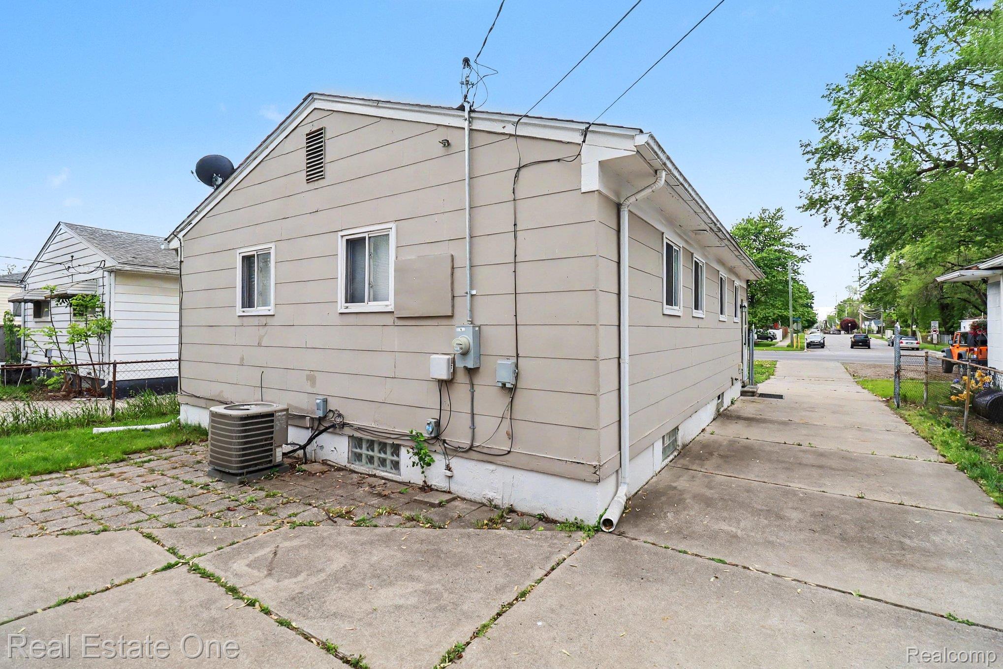 6305 Beech Daly Road Taylor, MI 48180 - Photo 22 of 22 View of home's exterior with a central AC unit