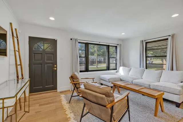 a living room with furniture and a window