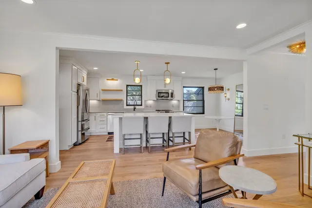 a living room with furniture and a table