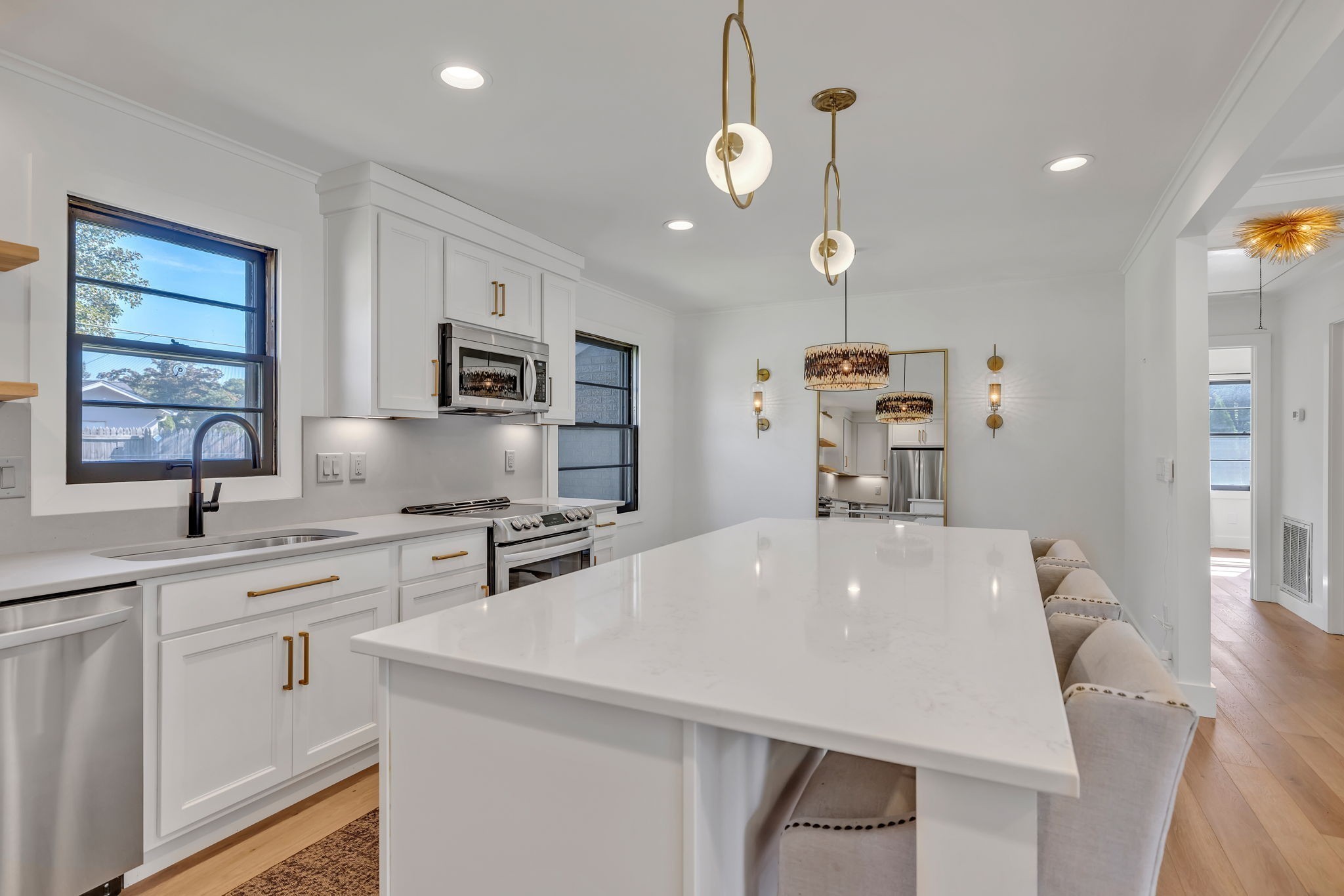 313 James Avenue Franklin, TN 37064 - Photo 21 of 49 a very nice looking kitchen with granite countertop a stove a sink a microwave and dining table