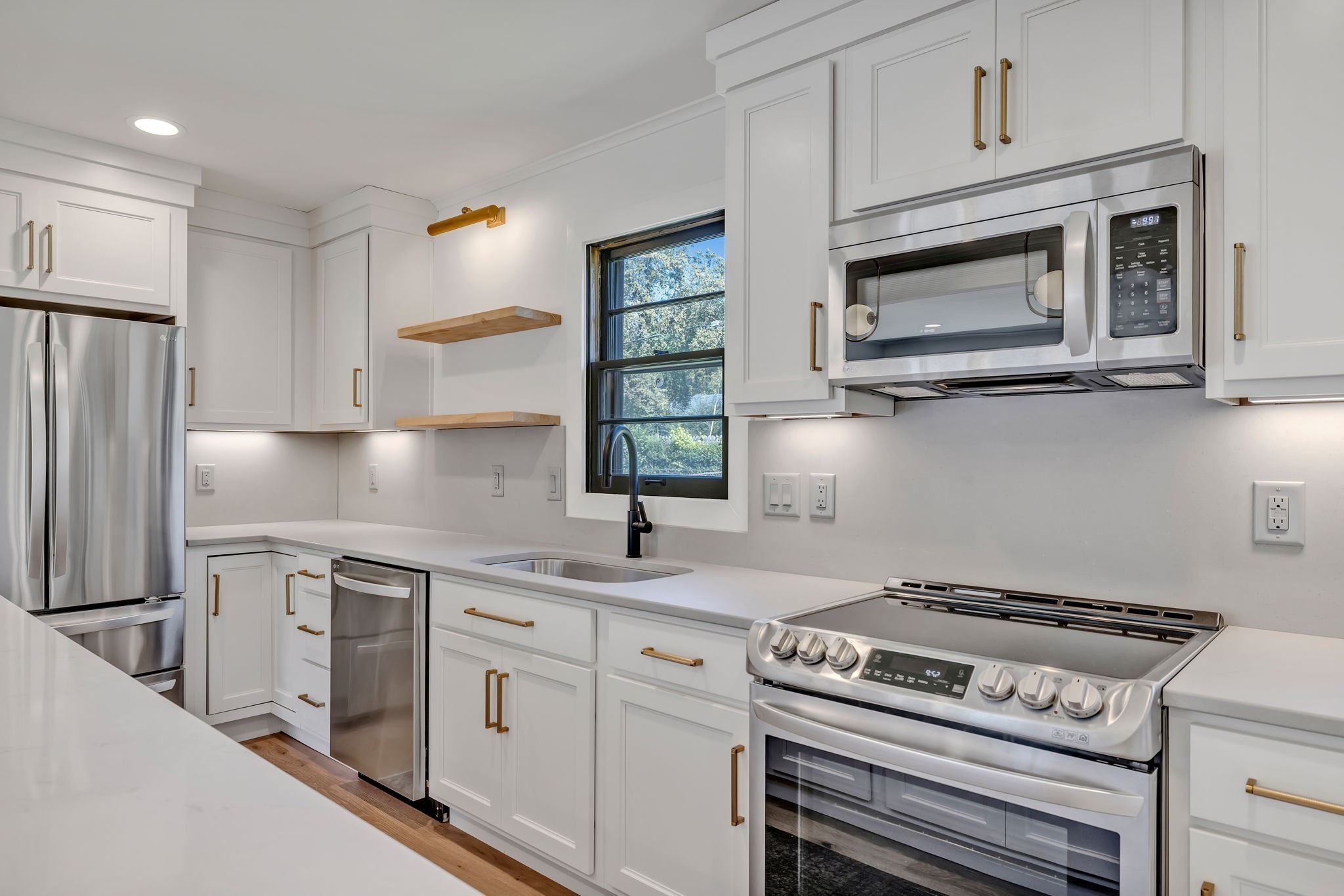 313 James Avenue Franklin, TN 37064 - Photo 25 of 49 a kitchen with white cabinets and appliances