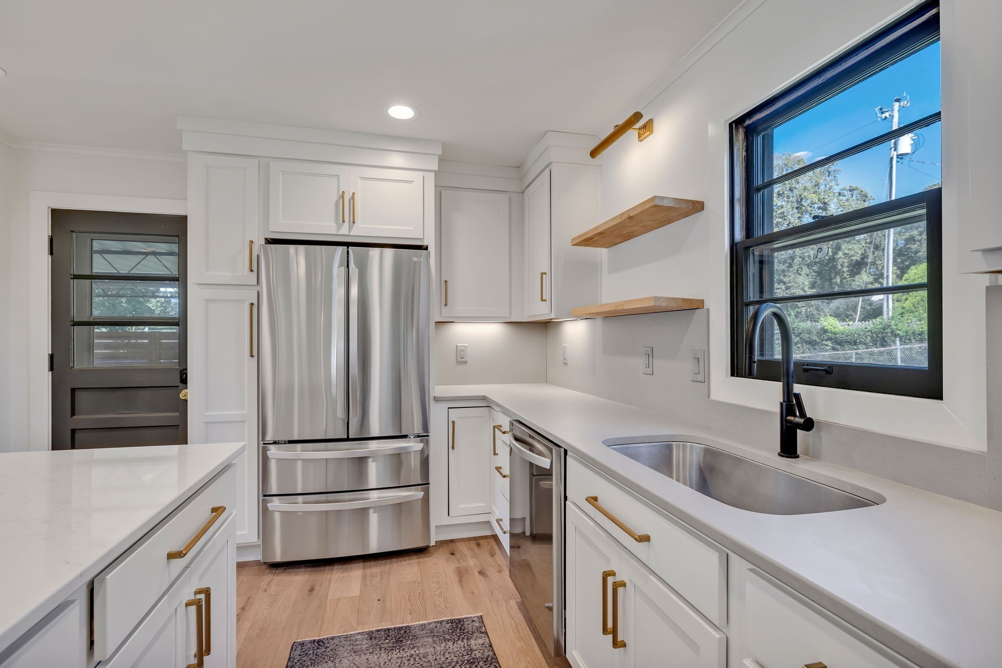 313 James Avenue Franklin, TN 37064 - Photo 27 of 49 a kitchen with stainless steel appliances granite countertop a refrigerator and a sink