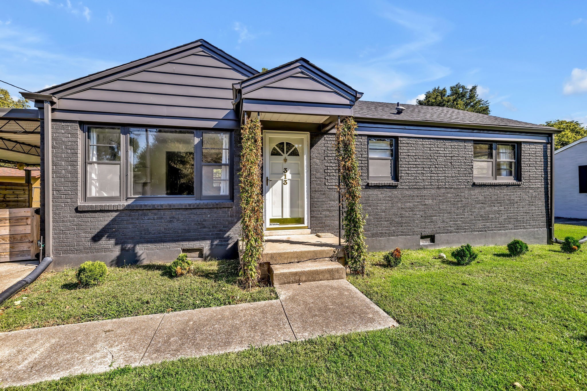 313 James Avenue Franklin, TN 37064 - Photo 3 of 49 a front view of a house with garden