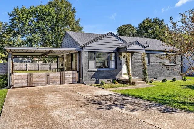 a view of a house with backyard porch and sitting area