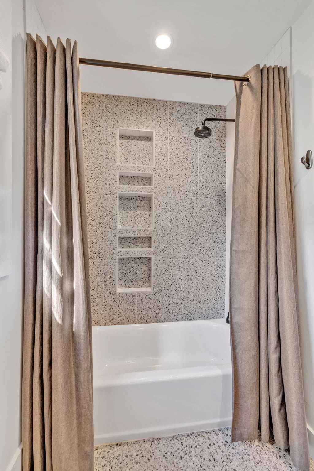 313 James Avenue Franklin, TN 37064 - Photo 42 of 49 a bathroom with a shower curtain and a tub