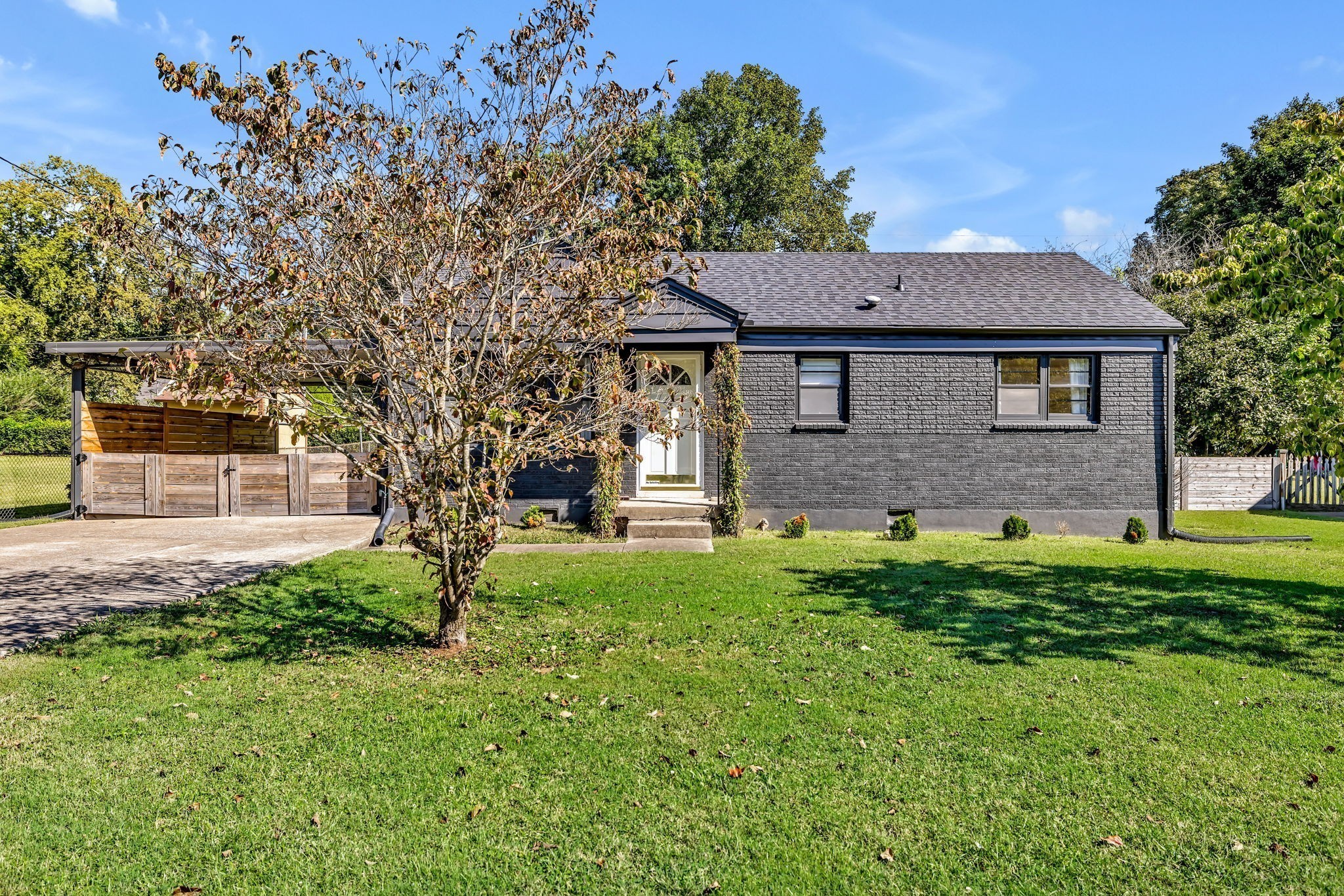 313 James Avenue Franklin, TN 37064 - Photo 5 of 49 a brick house with a yard