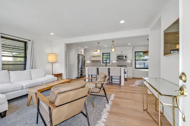 a living room with furniture and a table