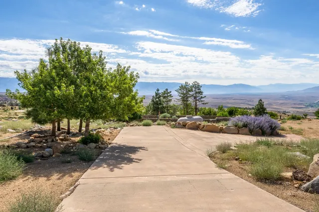 a view of a street with a building in the background
