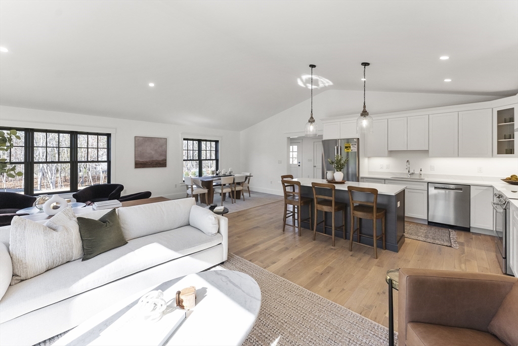 46 Sandwich Road, Unit 41 Plymouth, MA 02360 - Photo 2 of 42 a living room with lots of furniture and kitchen view