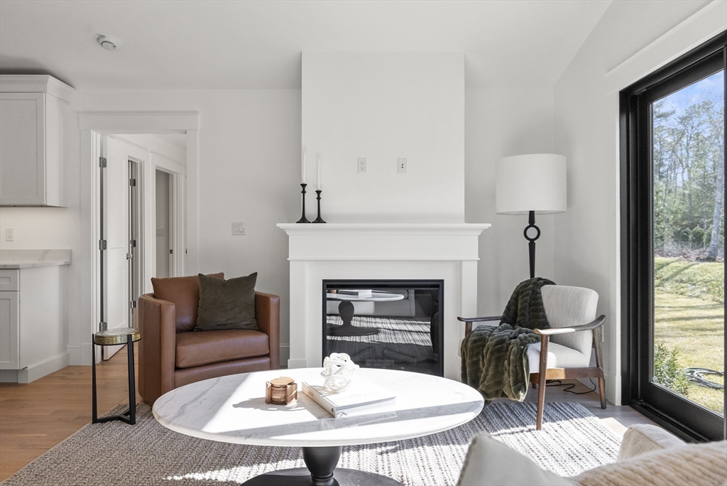 46 Sandwich Road, Unit 41 Plymouth, MA 02360 - Photo 23 of 42 a living room with furniture and a fireplace