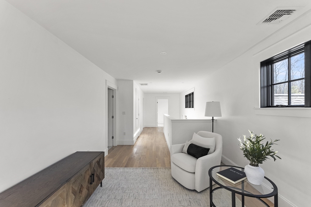 46 Sandwich Road, Unit 41 Plymouth, MA 02360 - Photo 31 of 42 a living room with furniture and a potted plant