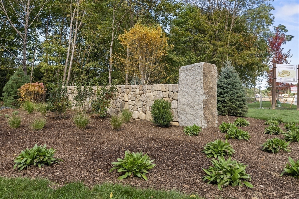 46 Sandwich Road, Unit 41 Plymouth, MA 02360 - Photo 39 of 42 a backyard of a house with lots of green space