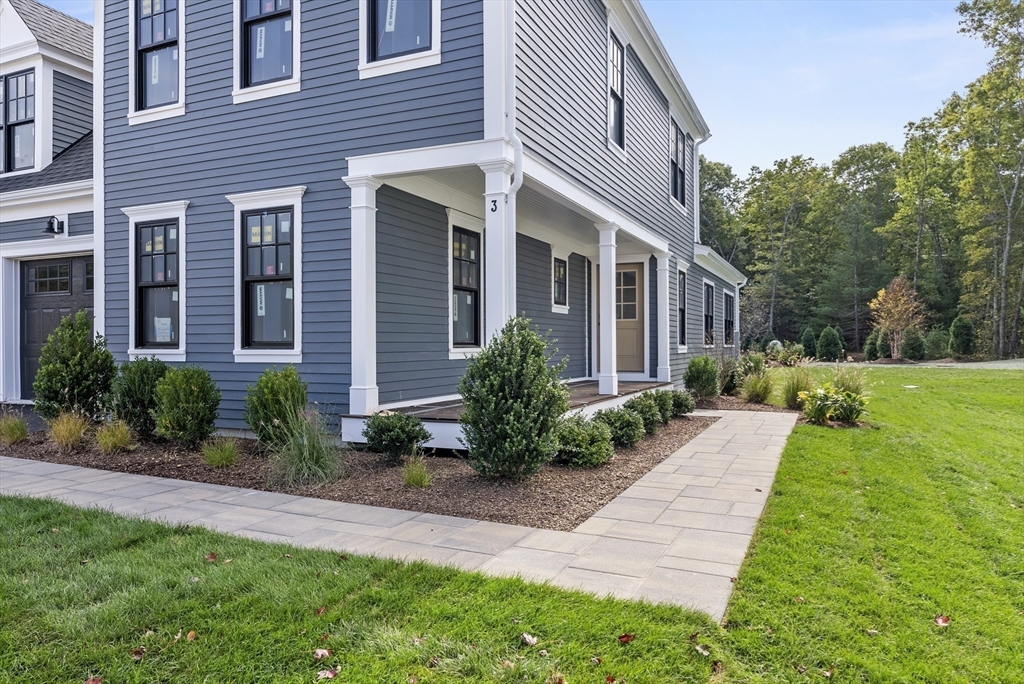 46 Sandwich Road, Unit 41 Plymouth, MA 02360 - Photo 6 of 42 a front view of a house with yard and green space