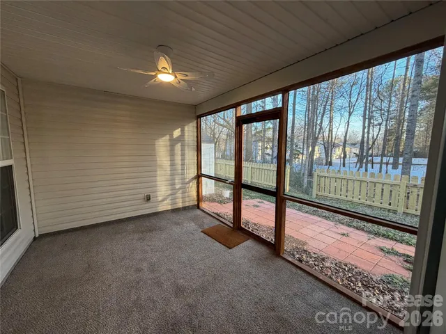 a view of an empty room with windows