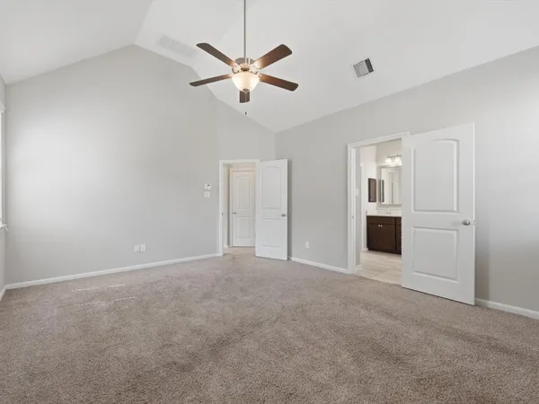 an empty room with windows and closet