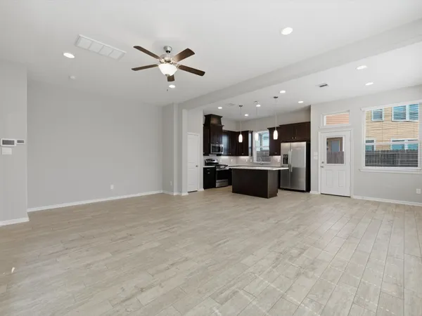 a kitchen with granite countertop a sink and steel appliances