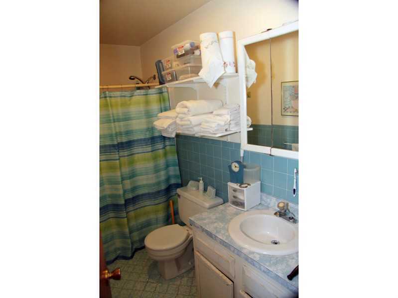 87 Strickland Road Cos Cob, CT 06807 - Photo 5 of 5 a bathroom with a sink toilet and shower