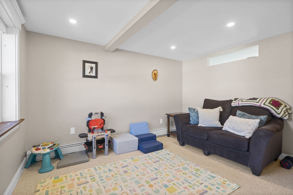 7 Rainbow Terrace Danvers, MA 01923 - Photo 11 of 33 a bedroom with furniture and a potted plant