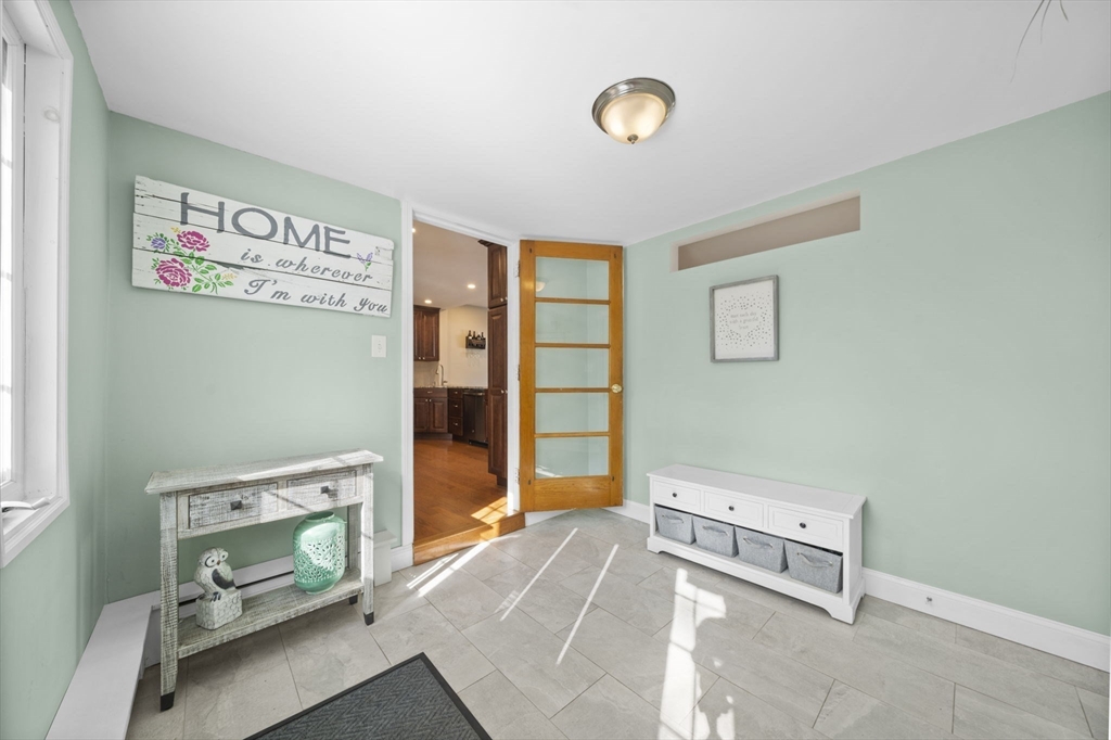 7 Rainbow Terrace Danvers, MA 01923 - Photo 14 of 33 a living room with a bed furniture and a window