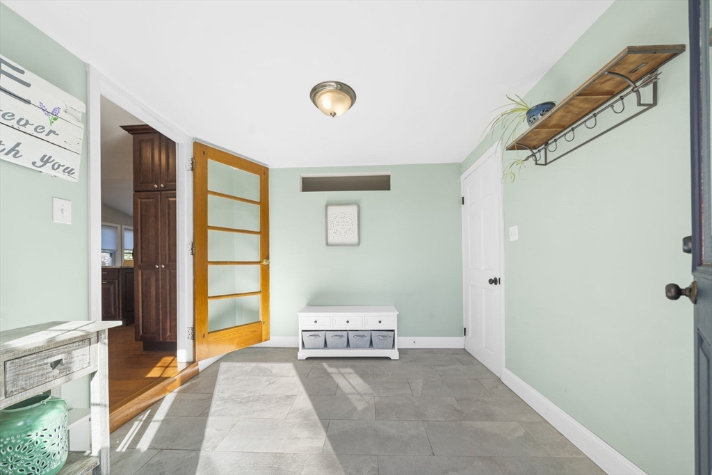 7 Rainbow Terrace Danvers, MA 01923 - Photo 15 of 33 a spacious bedroom with a bed and a window