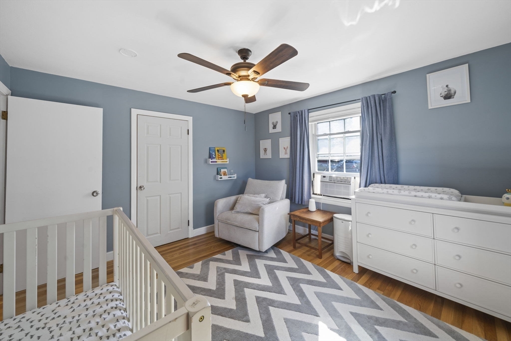 7 Rainbow Terrace Danvers, MA 01923 - Photo 17 of 33 a living room with furniture and a chandelier