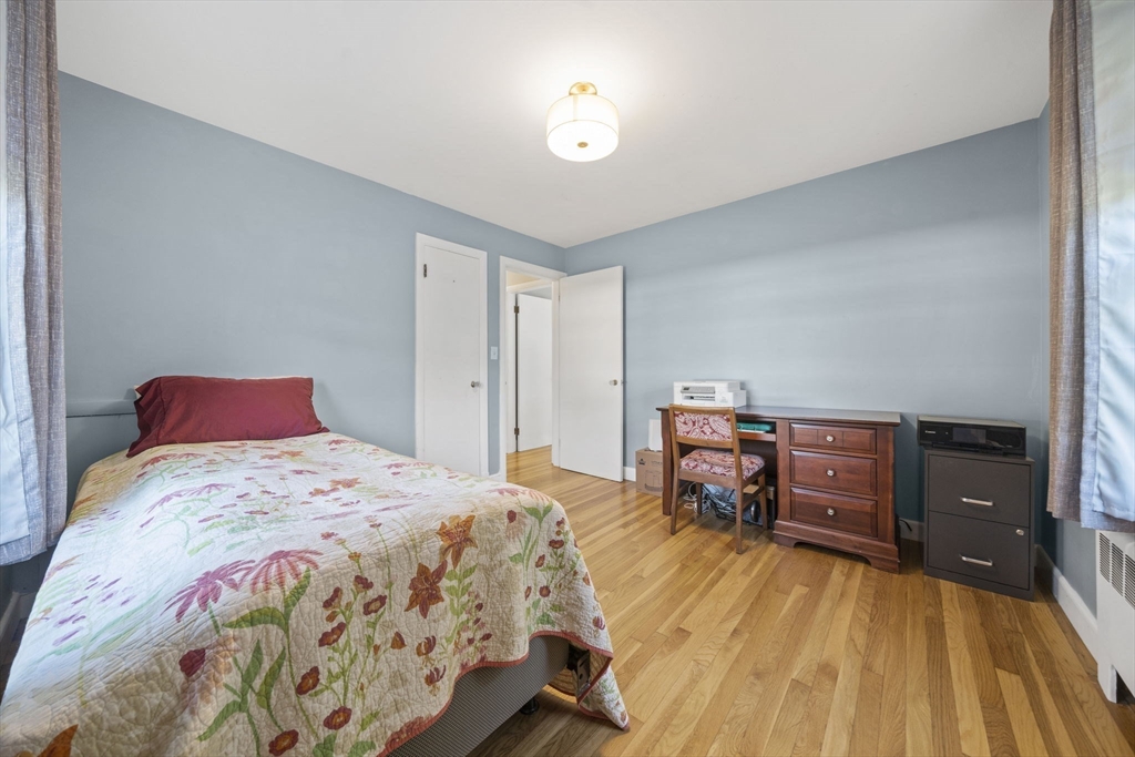 7 Rainbow Terrace Danvers, MA 01923 - Photo 18 of 33 a bedroom with a bed and a dresser