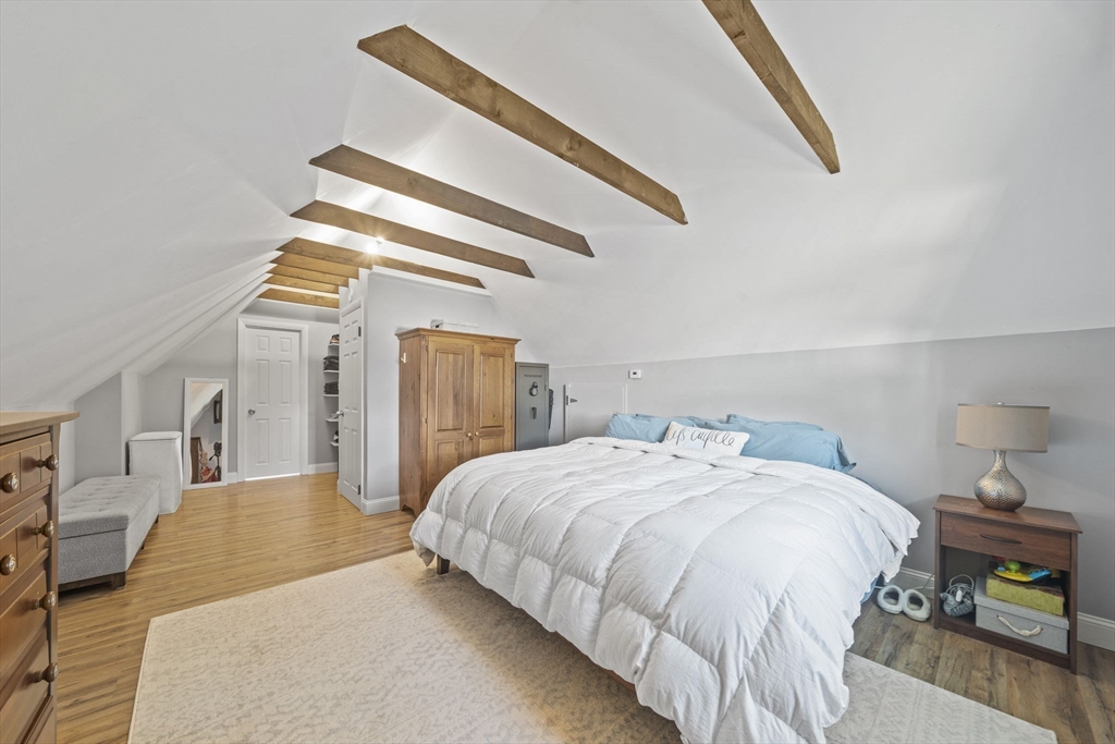 7 Rainbow Terrace Danvers, MA 01923 - Photo 22 of 33 a bedroom with a bed and a lamp