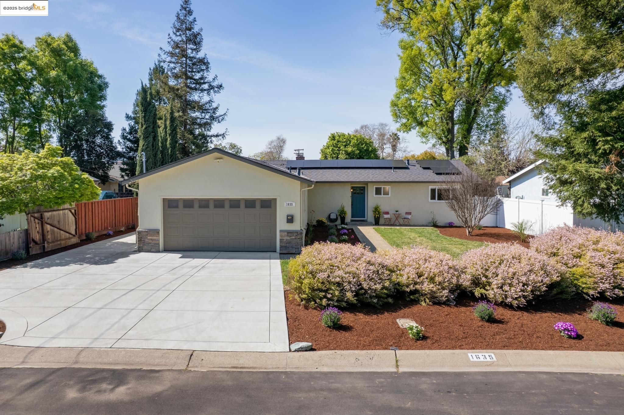 1635 Deardorff Lane Concord, CA 94519 - Photo 1 of 1 a front view of a house with a yard and garage