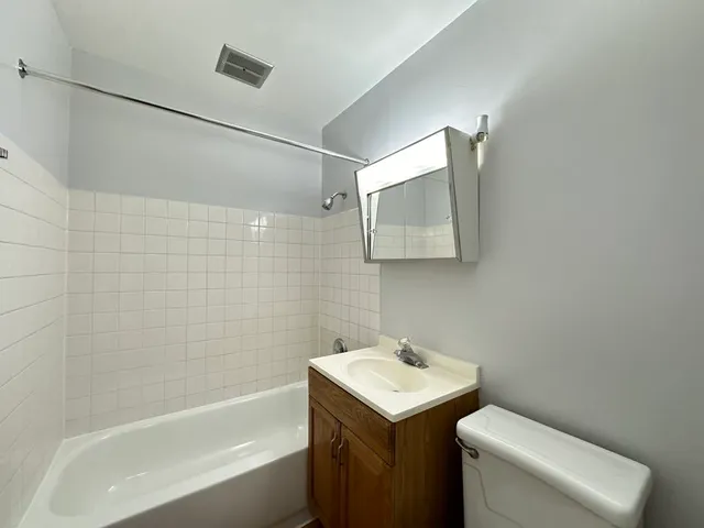 a bathroom with a sink toilet and bathtub