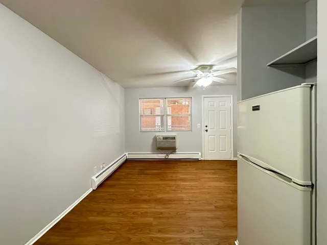 a view of a kitchen with a dishwasher and a refrigerator