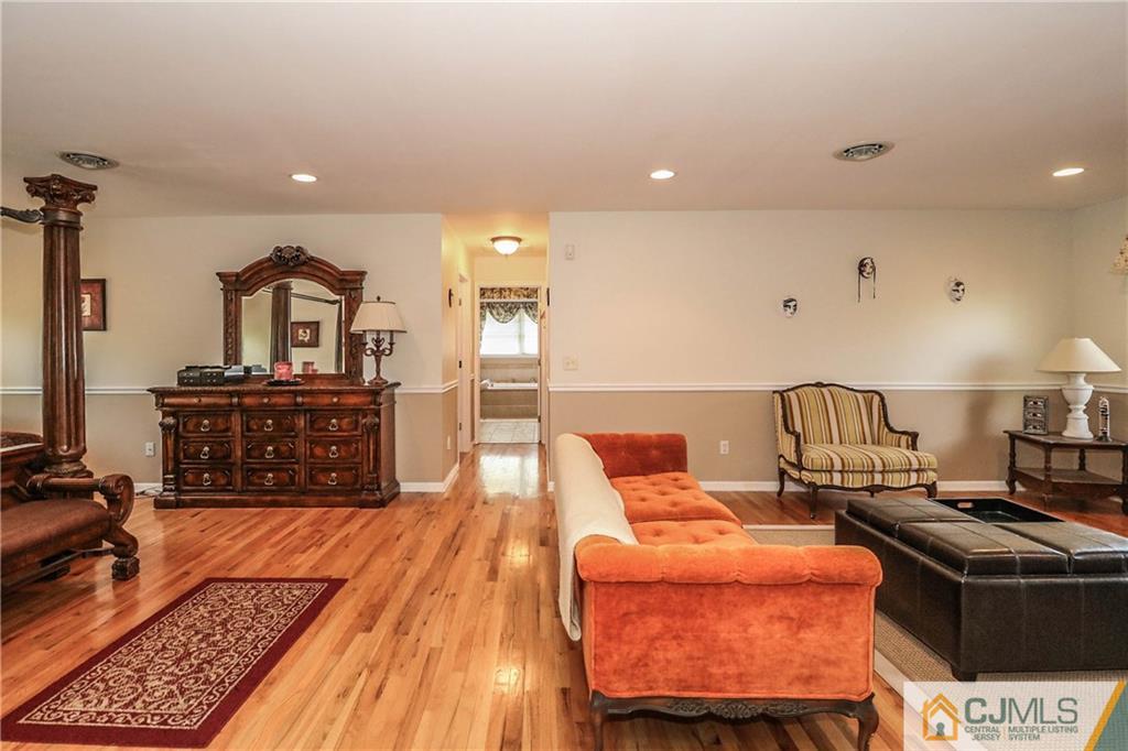 1115 New Dover Road Edison, NJ 08820 - Photo 14 of 25 a living room with a couch and a flat screen tv