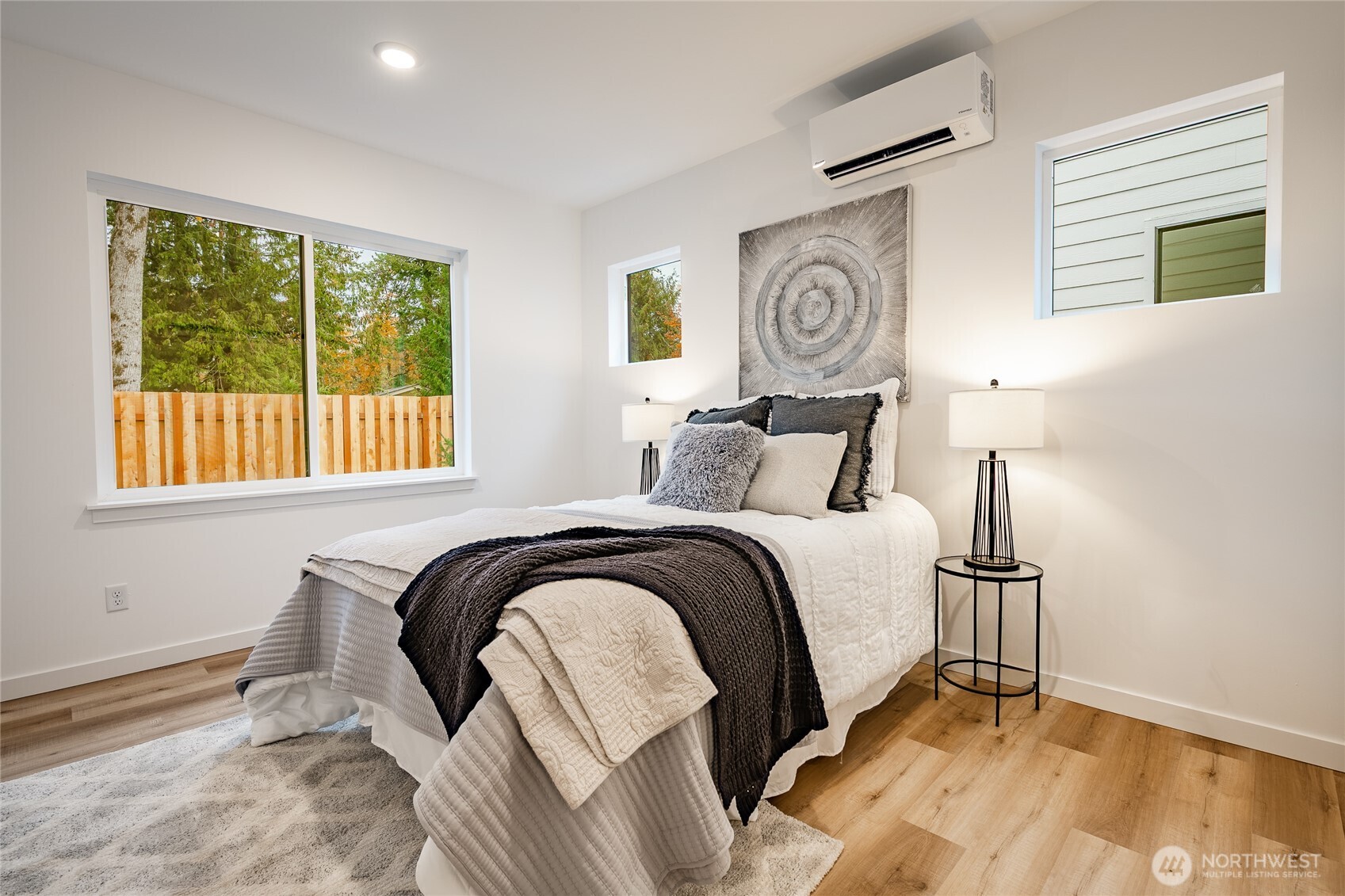 2986 Cedar View Road Blaine, WA 98230 - Photo 26 of 40 a bedroom with a bed and painting on the wall