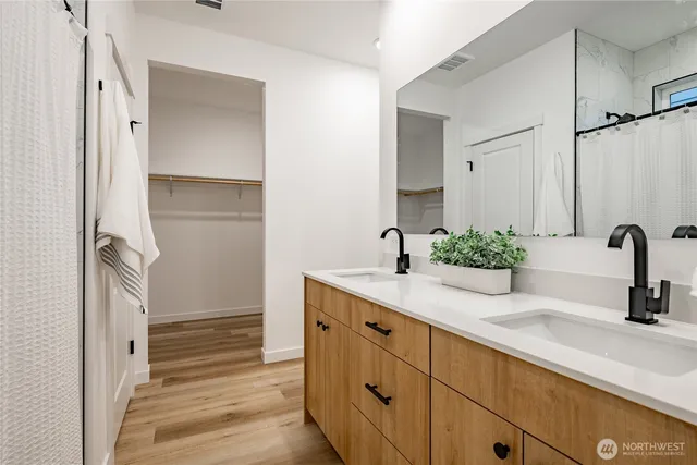 a bathroom with a shower and a mirror