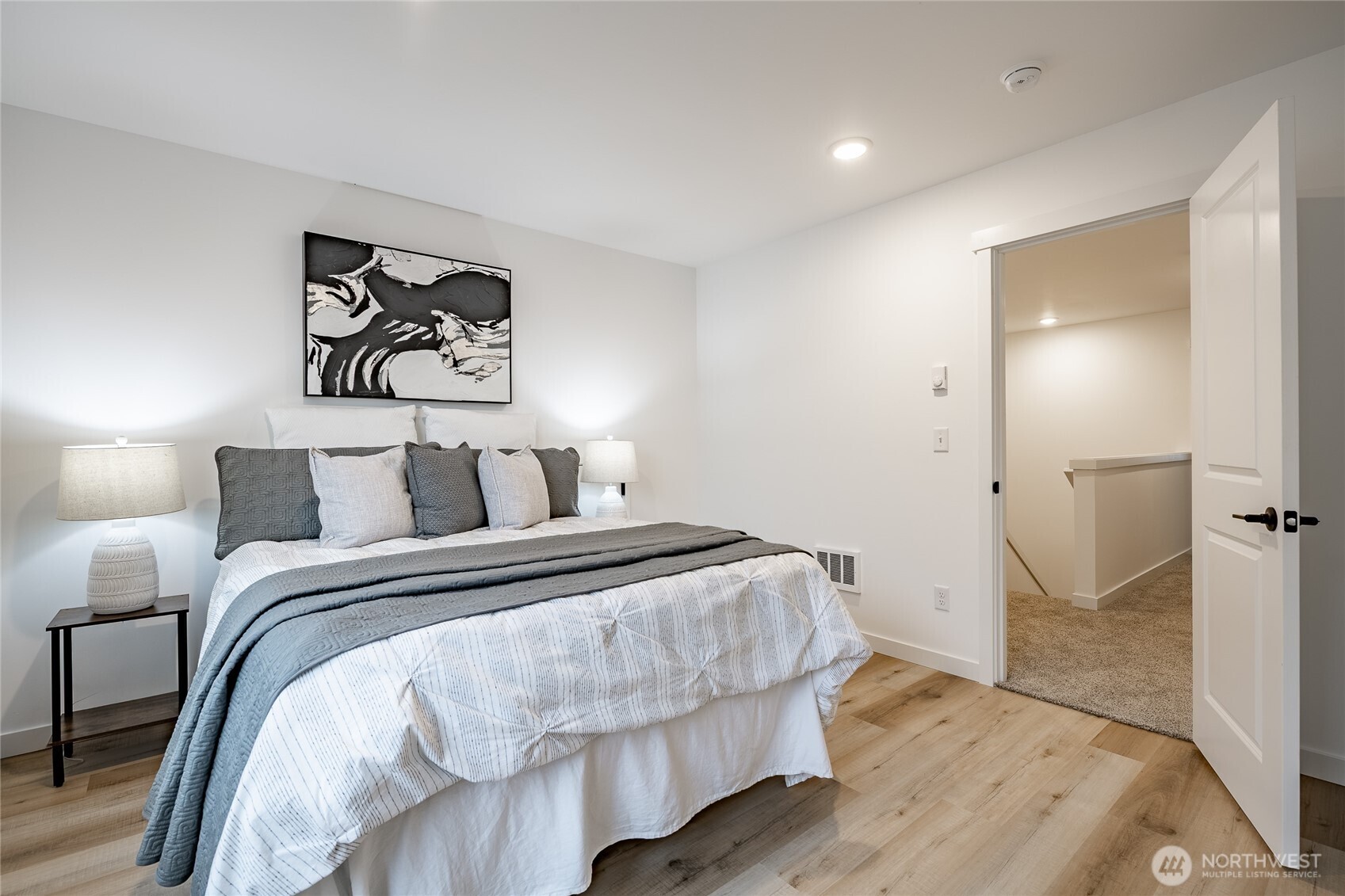 2986 Cedar View Road Blaine, WA 98230 - Photo 33 of 40 a bedroom with a bed and painting on the wall