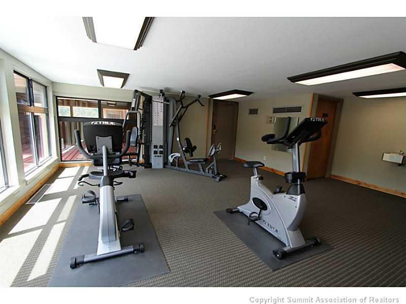 800 Copper Road, Unit 179 Copper Mountain, CO 80443 - Photo 18 of 23 a room with gym equipment and a large window