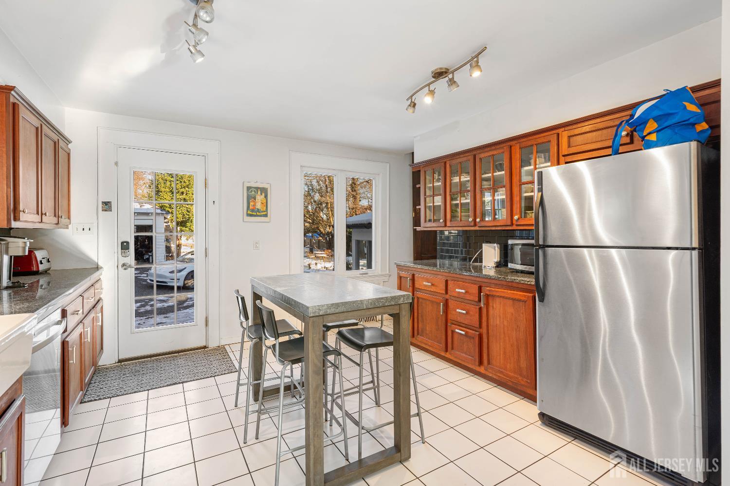 631 Union Avenue Elizabeth, NJ 07208 - Photo 13 of 30 a kitchen with stainless steel appliances granite countertop a refrigerator and a stove top oven