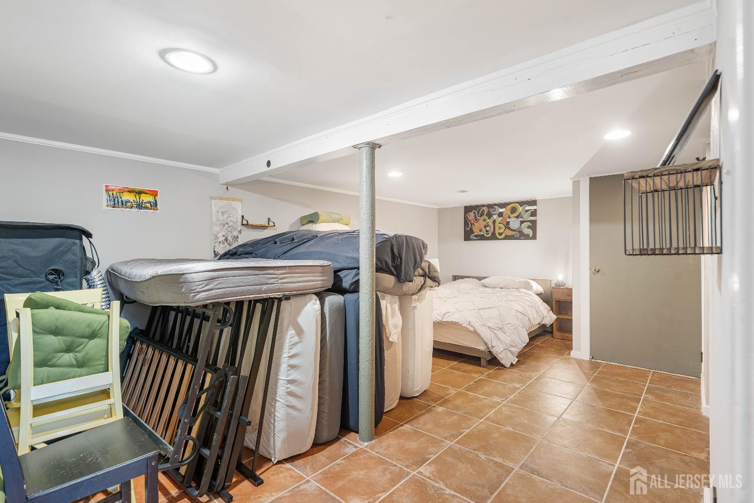 631 Union Avenue Elizabeth, NJ 07208 - Photo 20 of 30 a bedroom with furniture and a table