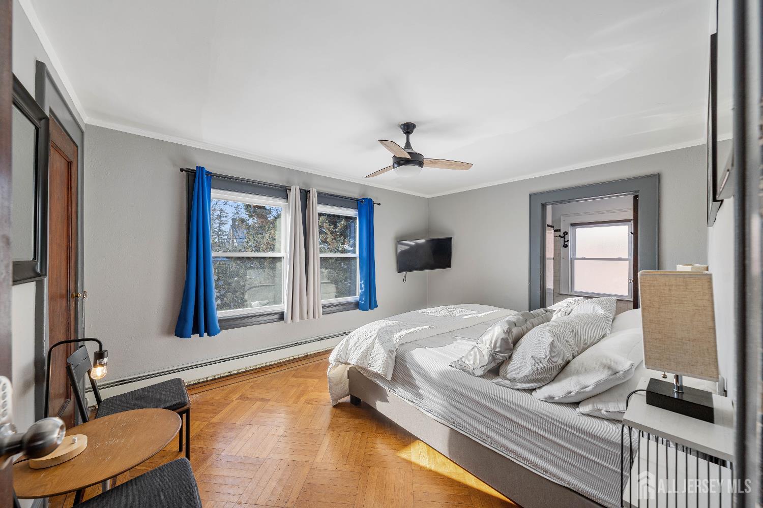 631 Union Avenue Elizabeth, NJ 07208 - Photo 22 of 30 a bedroom with a bed and dresser with mirror