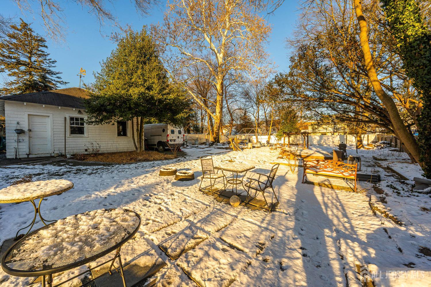 631 Union Avenue Elizabeth, NJ 07208 - Photo 27 of 30 a backyard of a house with barbeque oven table and chairs