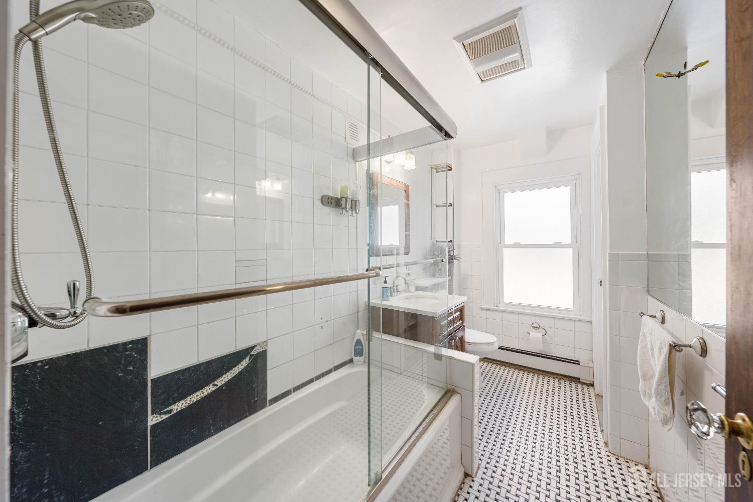 631 Union Avenue Elizabeth, NJ 07208 - Photo 10 of 30 a bathroom with a sink a toilet and shower