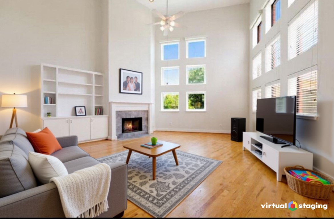 a living room with furniture a rug and a flat screen tv