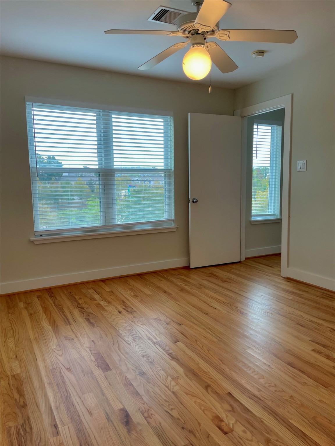 5509 Cornish Street Houston, TX 77007 - Photo 11 of 15 a view of an empty room with wooden floor and a window