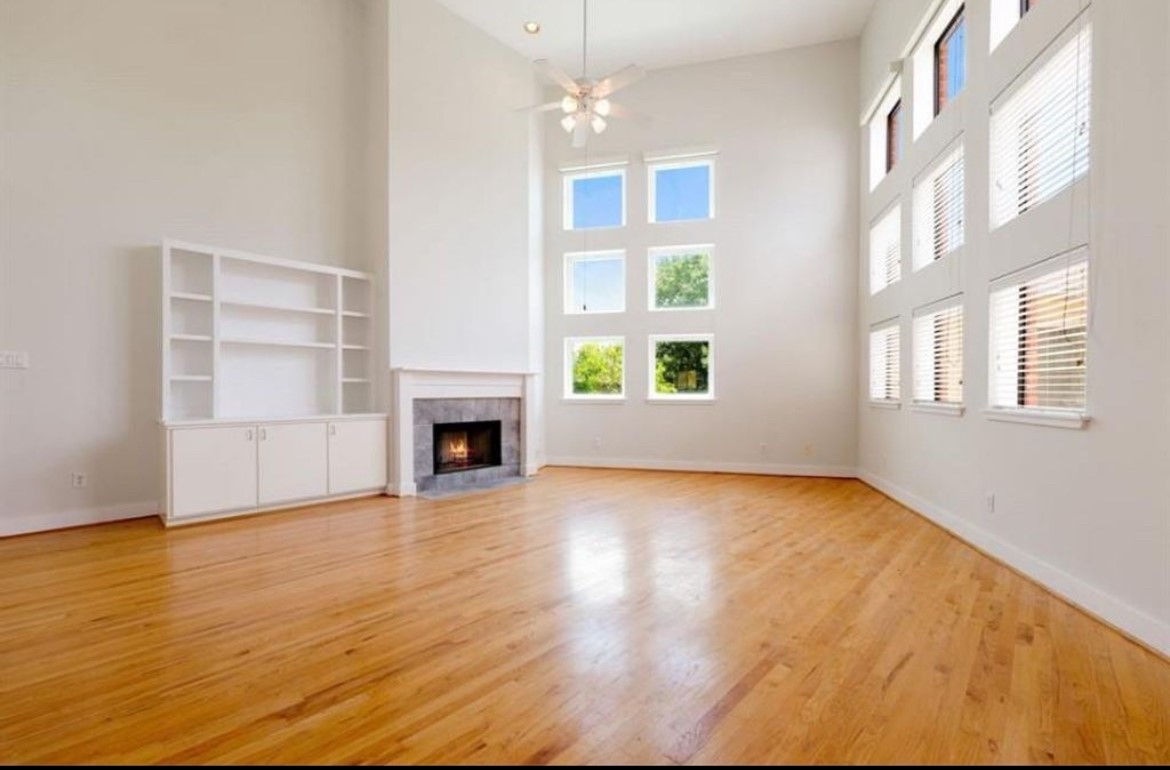 5509 Cornish Street Houston, TX 77007 - Photo 4 of 15 a view of an empty room with a window and fireplace