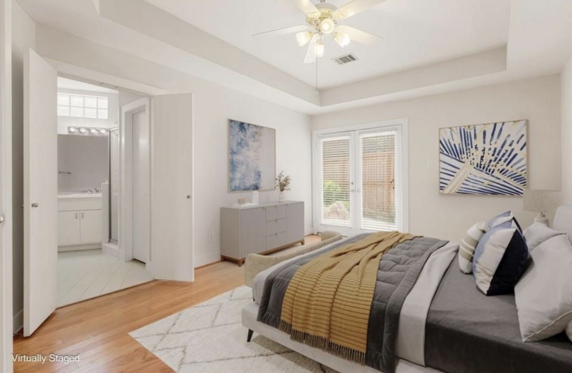 5509 Cornish Street Houston, TX 77007 - Photo 8 of 15 a bedroom with a large bed and a chandelier