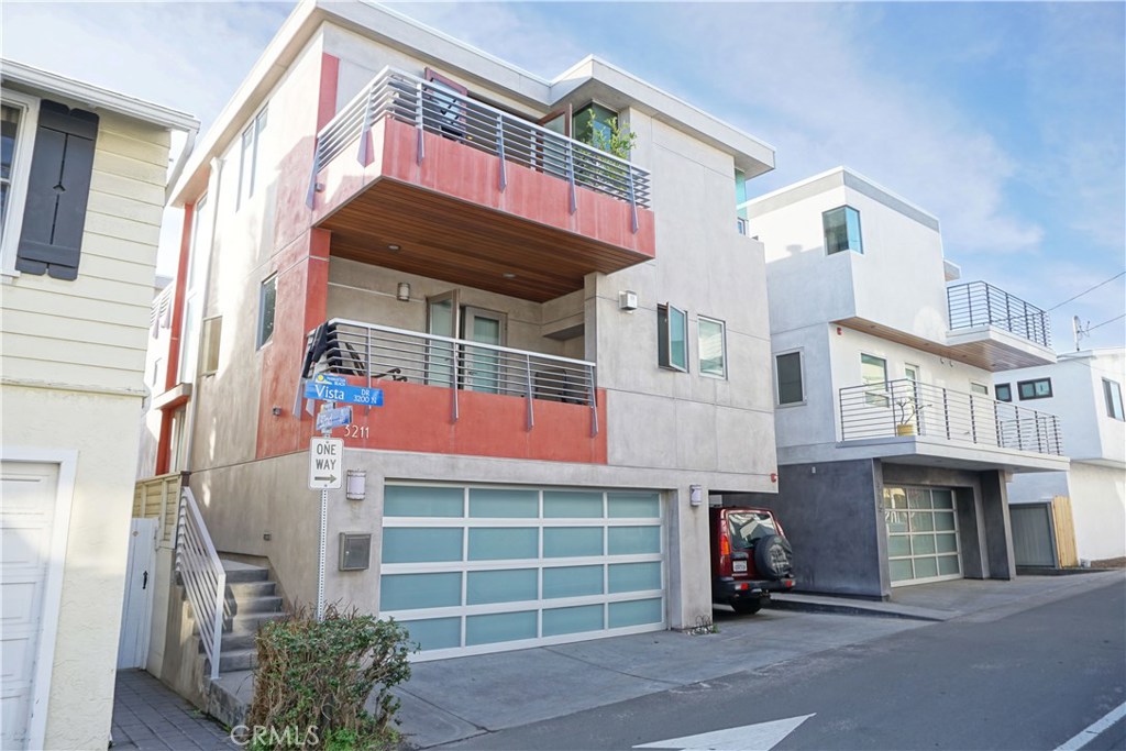 3211 Vista Drive Manhattan Beach, CA 90266 - Photo 1 of 35 a front view of a house with a yard and garage