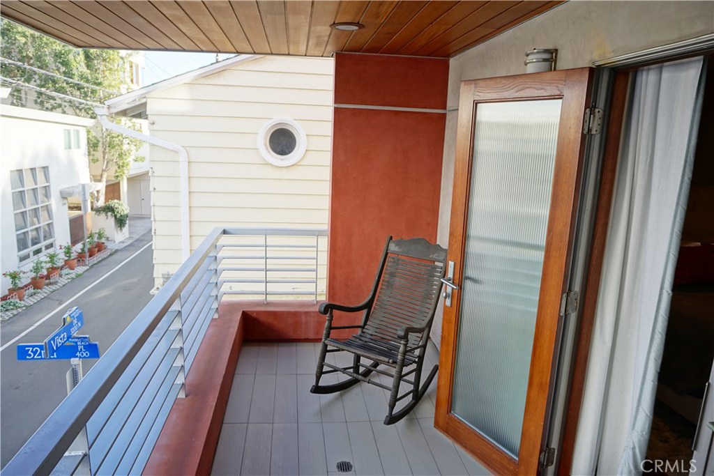 3211 Vista Drive Manhattan Beach, CA 90266 - Photo 21 of 35 a view of a balcony with chair and next to a window