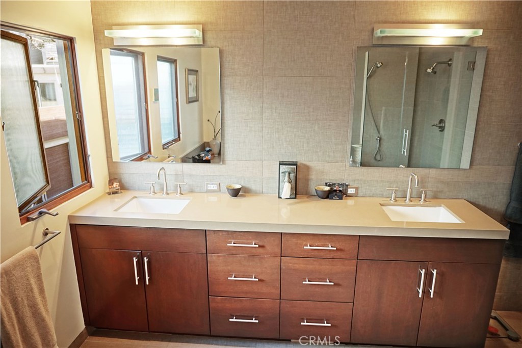 3211 Vista Drive Manhattan Beach, CA 90266 - Photo 23 of 35 a bathroom with a sink vanity and a mirror