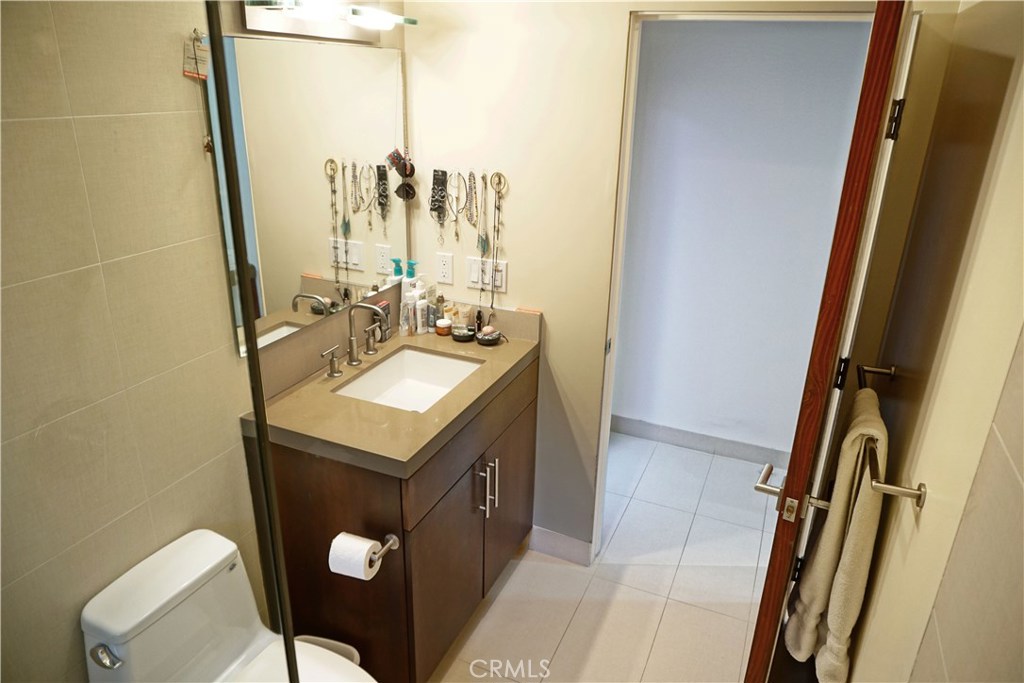 3211 Vista Drive Manhattan Beach, CA 90266 - Photo 32 of 35 a bathroom with a sink mirror vanity and toilet