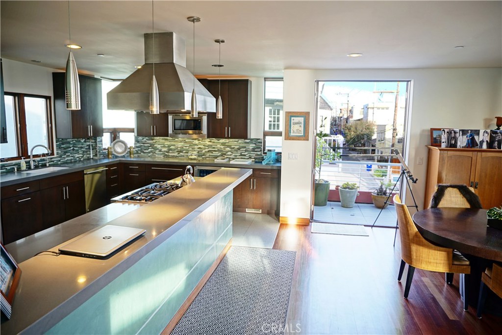 3211 Vista Drive Manhattan Beach, CA 90266 - Photo 7 of 35 a kitchen with sink stove and chairs
