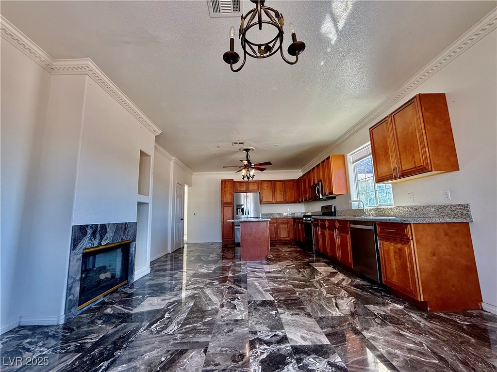 764 Benedict Drive Las Vegas, NV 89110 - Photo 12 of 30 Kitchen with ornamental molding, a textured ceilin
